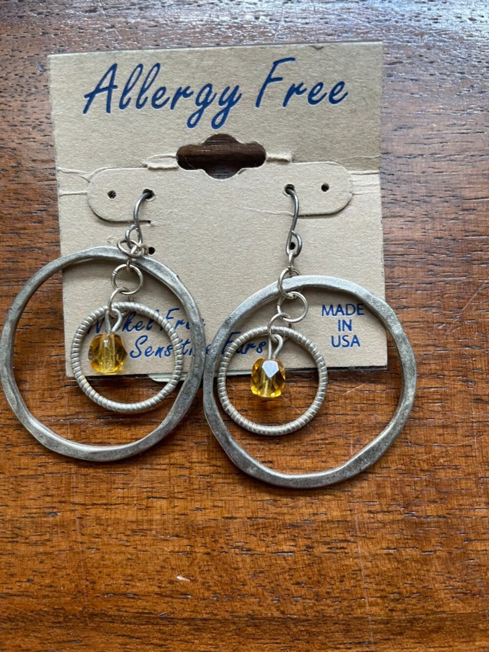 Bunde 3/$12.  Sliver Toned Concentric Circle Earrings With Amber Colored Bead.